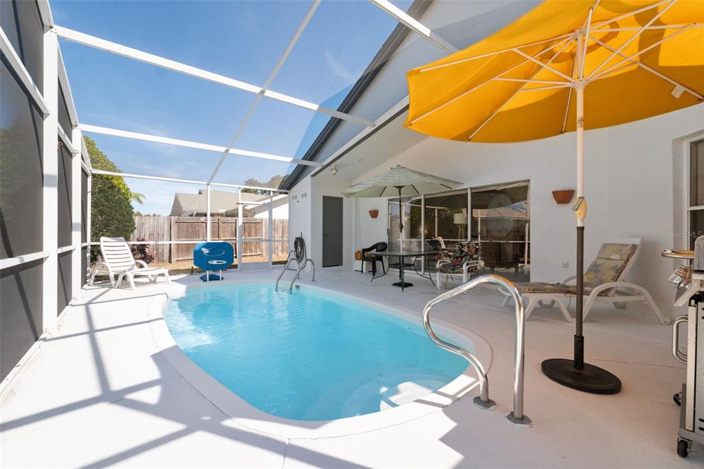 5301 El Cerro Drive New Port Richey, FL 34655 - Photo 23 of 31 a view of a swimming pool with seating area