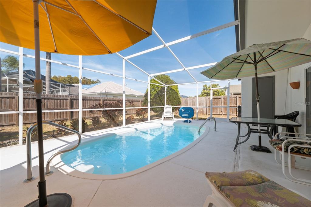 5301 El Cerro Drive New Port Richey, FL 34655 - Photo 3 of 31 a view of a swimming pool with a patio