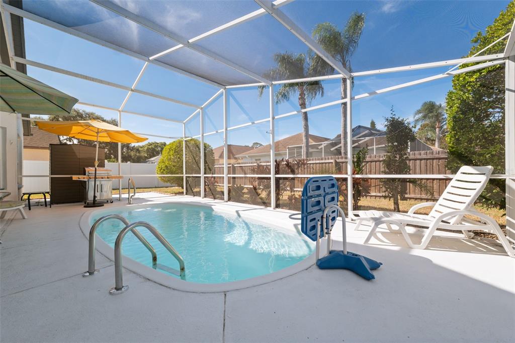5301 El Cerro Drive New Port Richey, FL 34655 - Photo 4 of 31 a view of a swimming pool with a porch