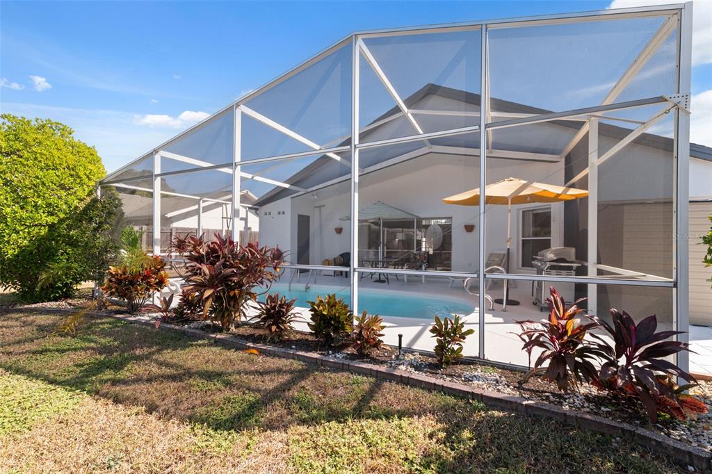5301 El Cerro Drive New Port Richey, FL 34655 - Photo 5 of 31 a view of a garage with a patio
