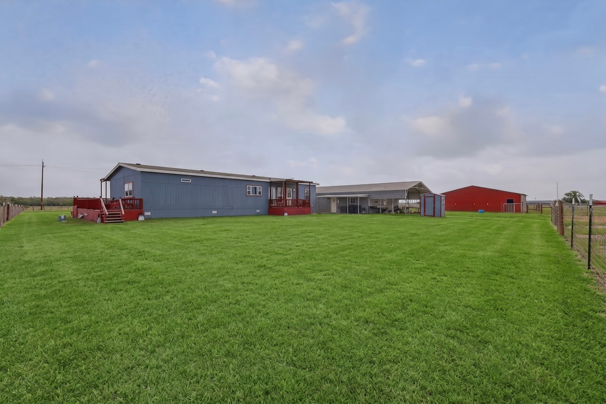 664 Garrett Road Yoakum, TX 77995 - Photo 24 of 39 Expansive grassy area with a wire fence perimeter - grass virtually added