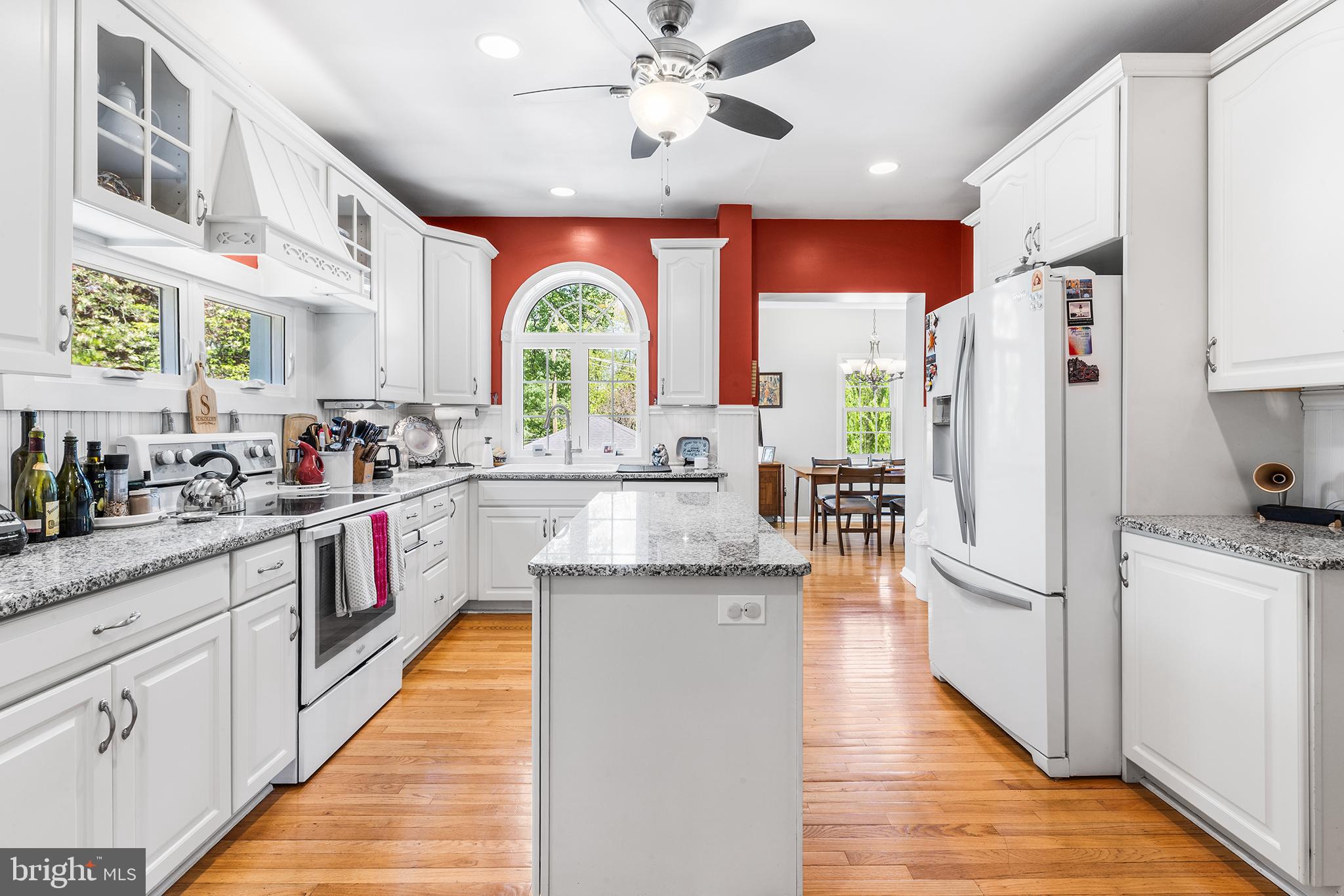 401 North Rolling Road Springfield, PA 19064 - Photo 13 of 79 a kitchen with stainless steel appliances granite countertop a refrigerator a sink dishwasher a stove and white countertops with wooden floor