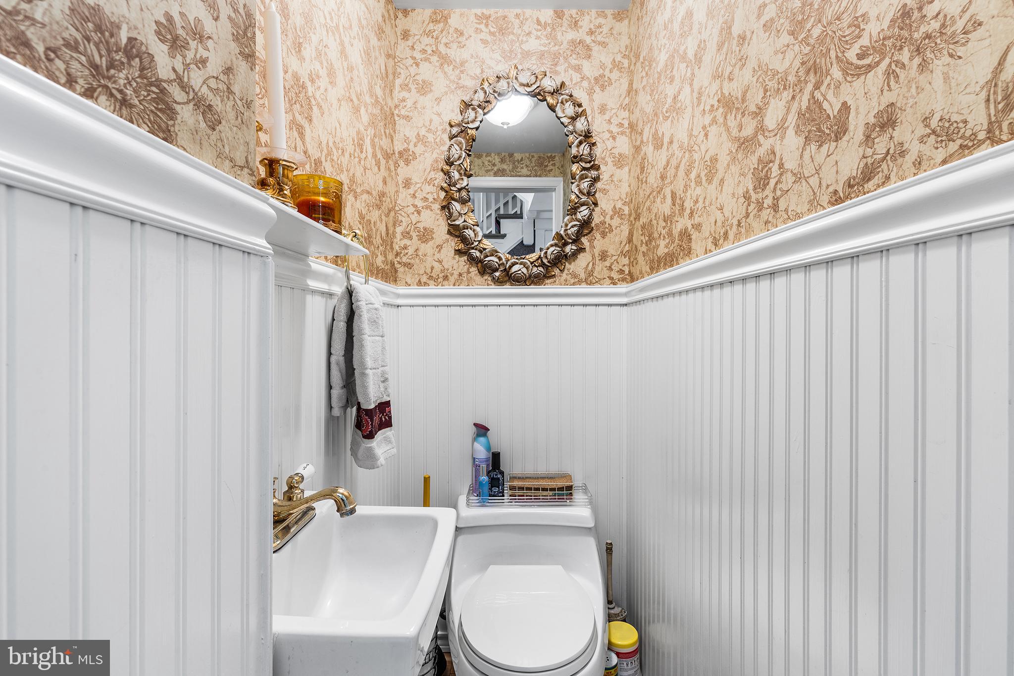 401 North Rolling Road Springfield, PA 19064 - Photo 21 of 79 a bathroom with a toilet and a sink