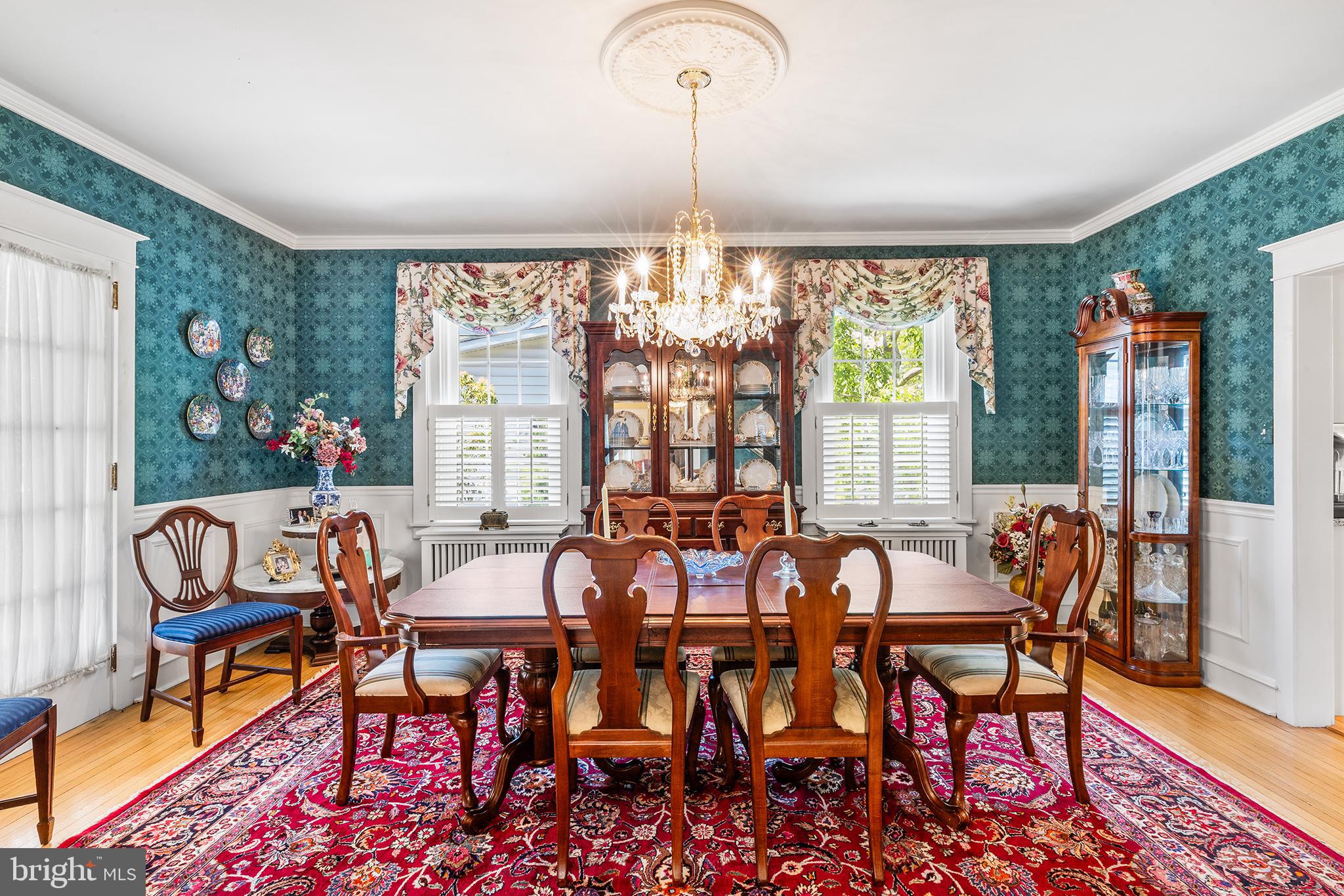 401 North Rolling Road Springfield, PA 19064 - Photo 10 of 79 a view of a dining room with furniture wooden floor and a chandelier