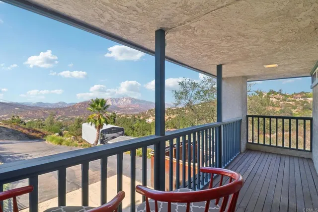 a view of a two chairs in balcony