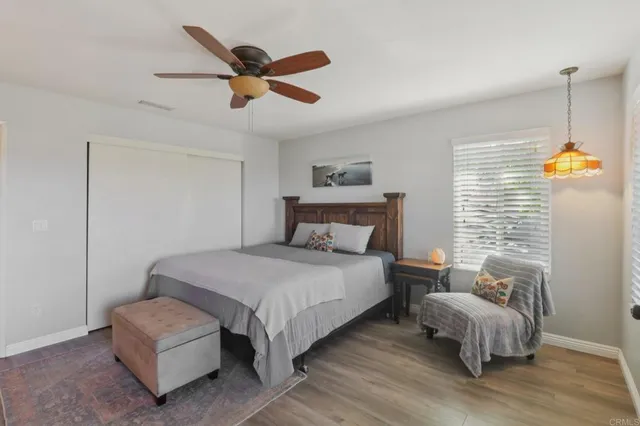 a view of a house with a backyard porch and sitting area