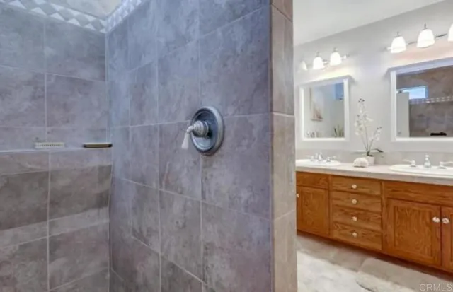a roof deck with table and chairs and potted plants