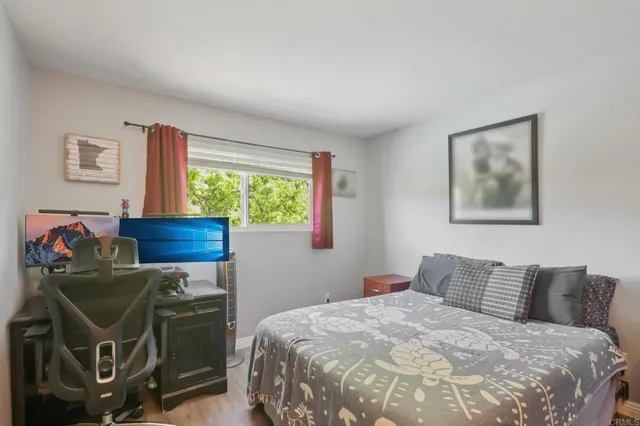 a balcony with wooden floor and trees