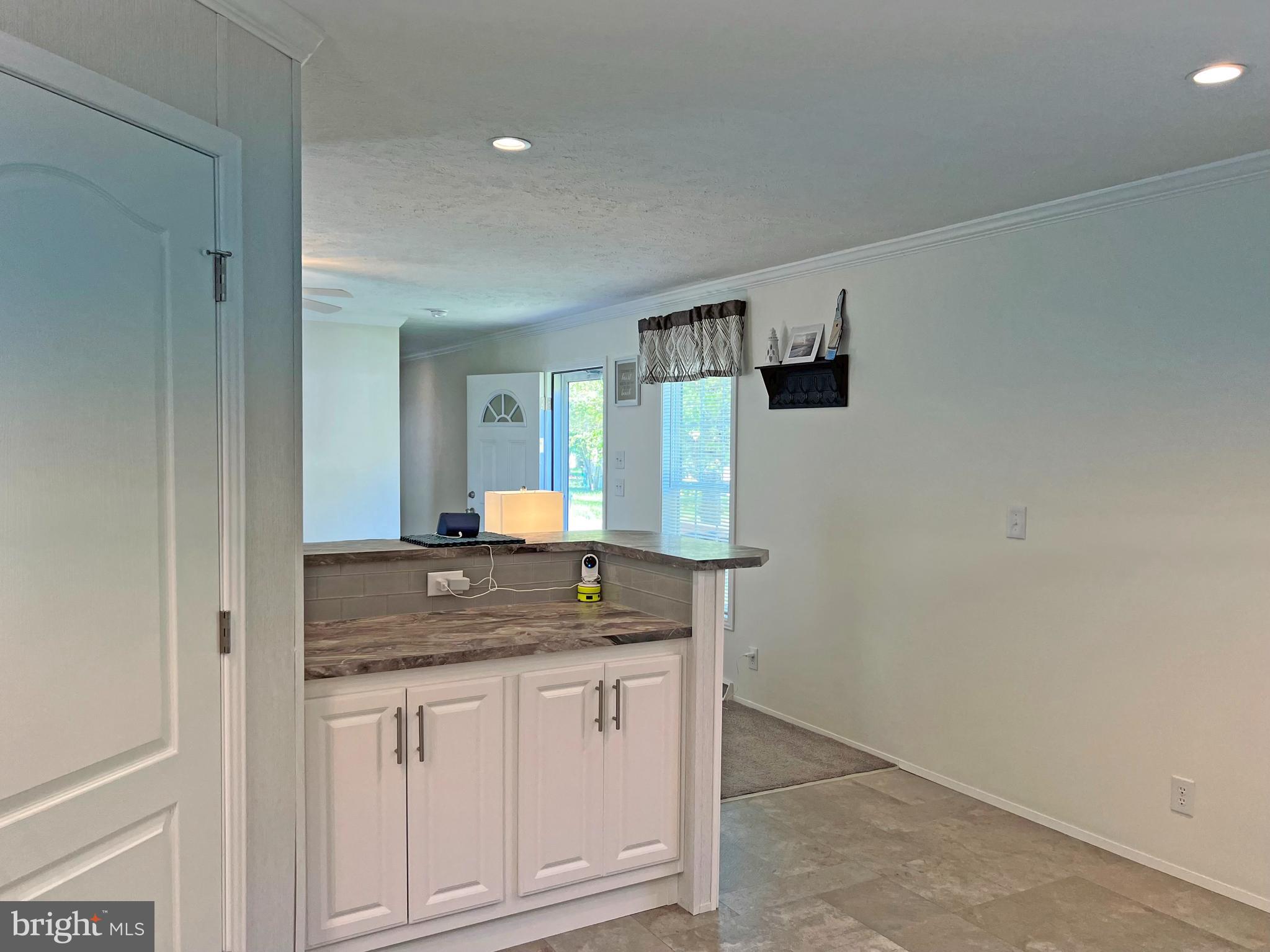 17217 Ridge Line Drive, Unit 72 Lewes, DE 19958 - Photo 21 of 34 Kitchen Access to the Laundry Room