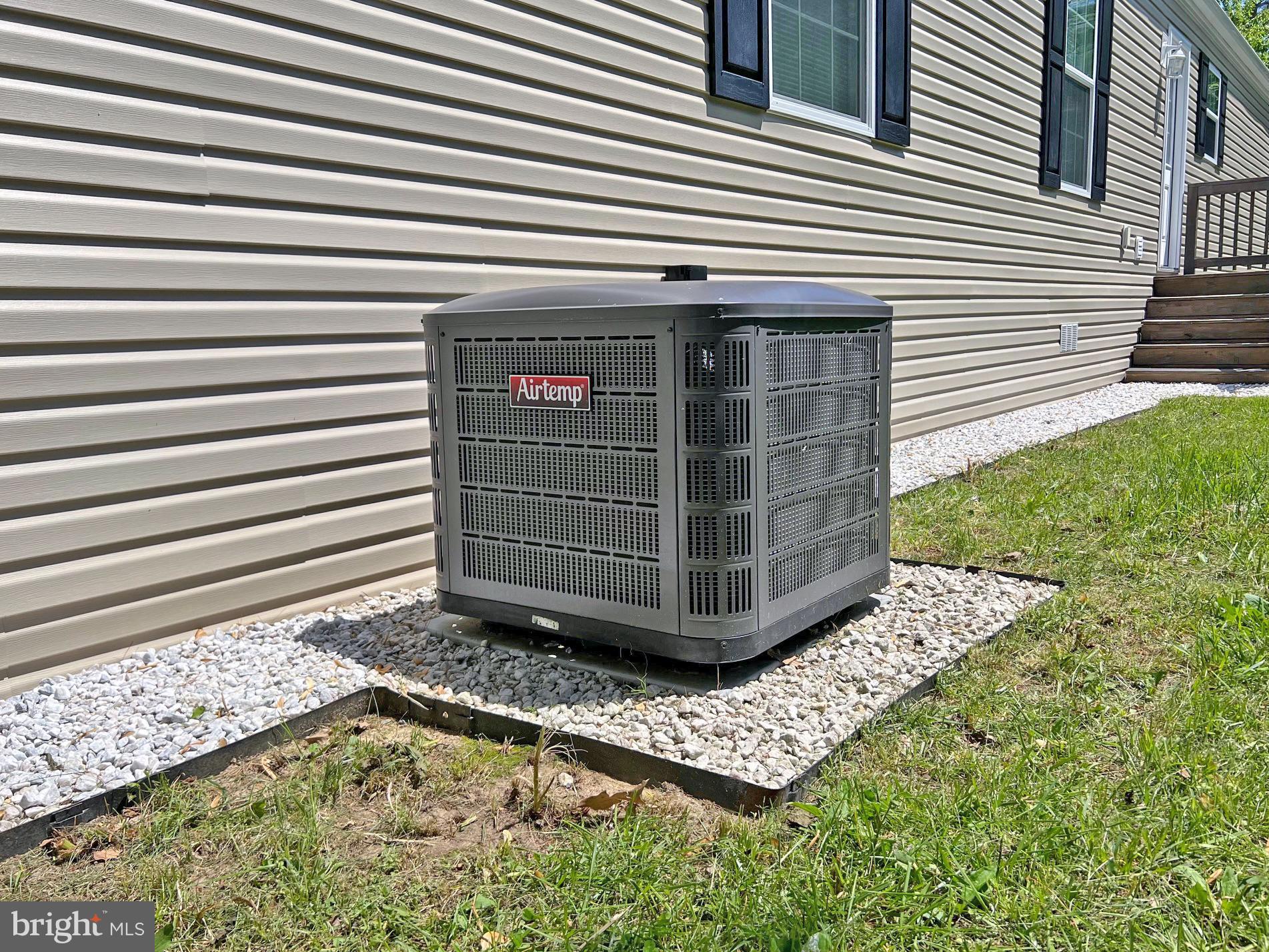 17217 Ridge Line Drive, Unit 72 Lewes, DE 19958 - Photo 28 of 34 AC Condenser