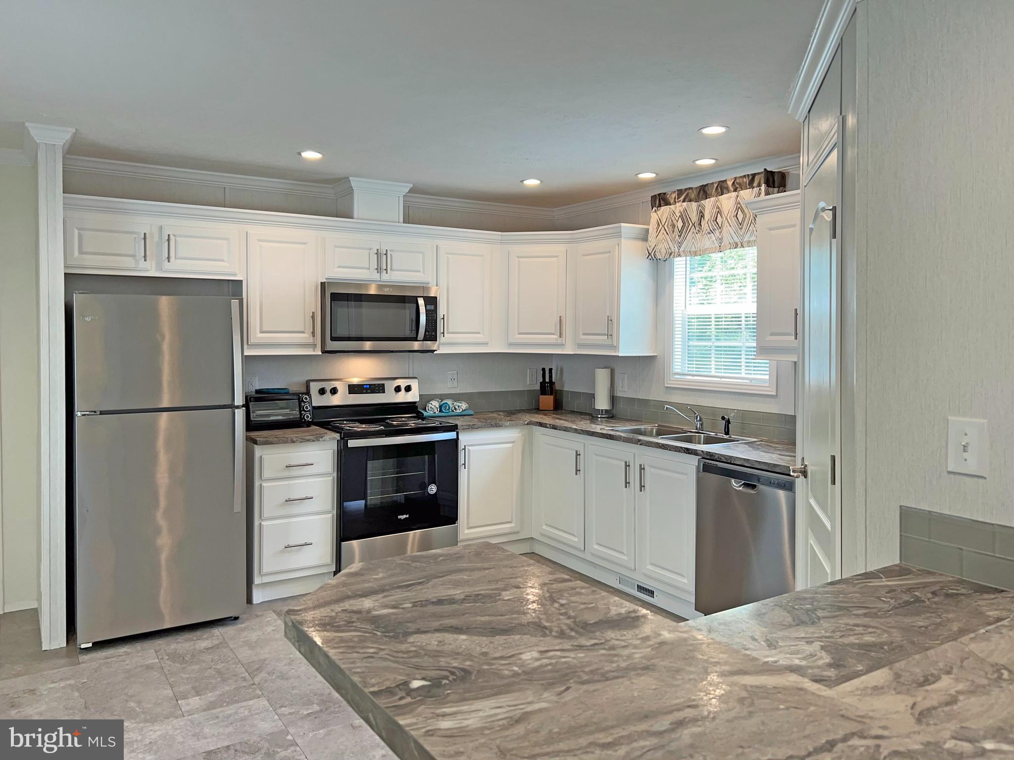 17217 Ridge Line Drive, Unit 72 Lewes, DE 19958 - Photo 5 of 34 L-Shaped Breakfast Bar