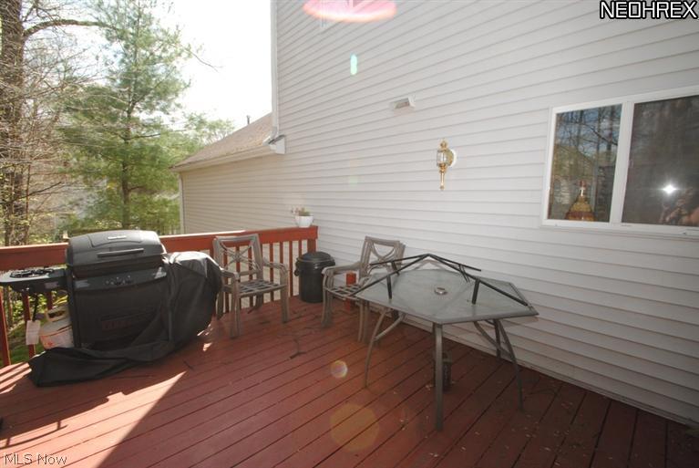 675 Briar Ridge Lane Akron, OH 44313 - Photo 19 of 20 A private deck overlooks woods...a perfect place to relax on those warm summer evenings.