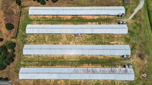 a view of a back yard of the house and a lake view