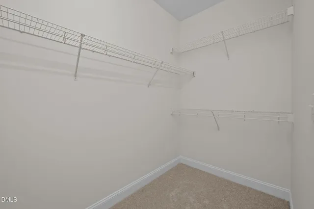 an aerial view of multiple houses with a yard