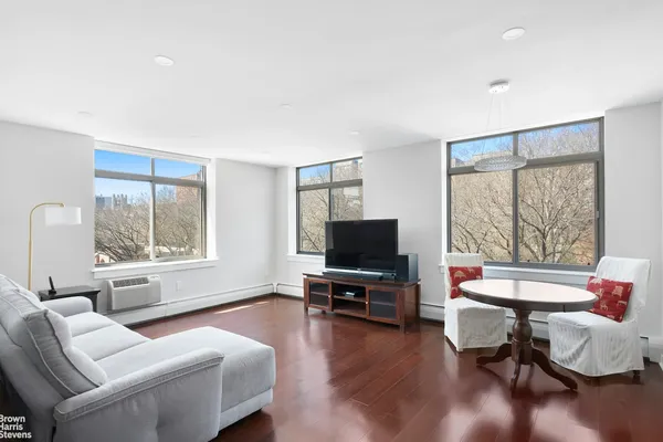 a view of a living room with kitchen