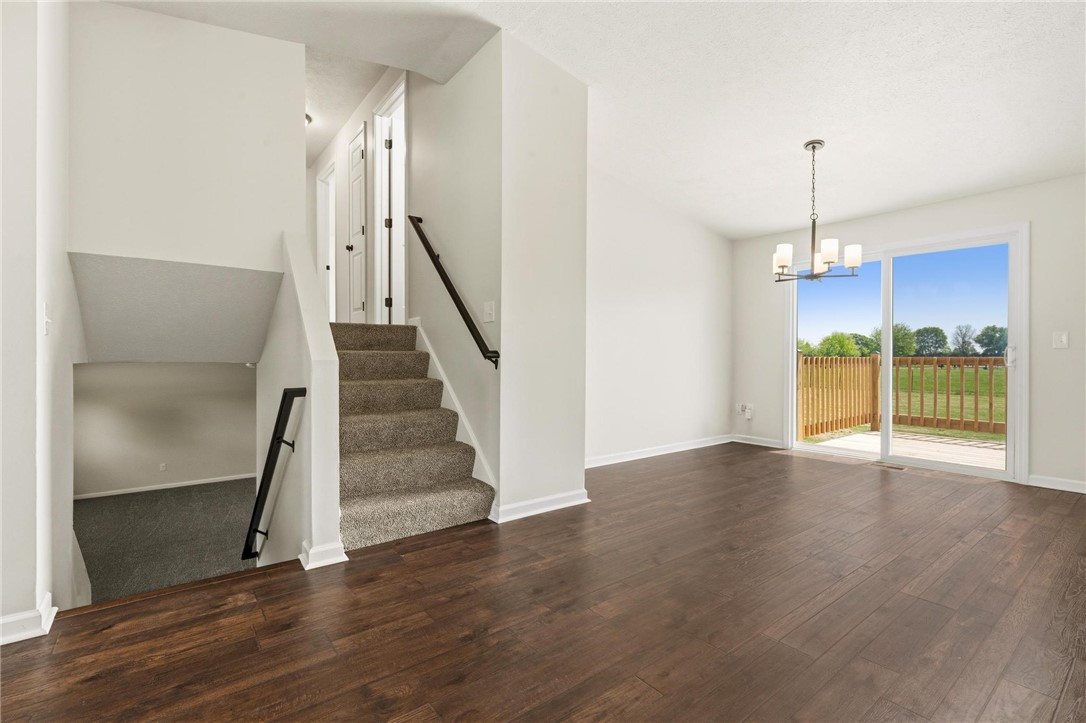 1353 Foust Road Xenia, OH 45385 - Photo 28 of 50 Bright interior features wood flooring and a sliding glass door to a deck, offering inviting outdoor access.