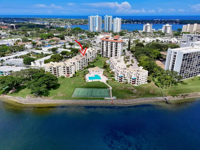 an aerial view of a house with a lake view