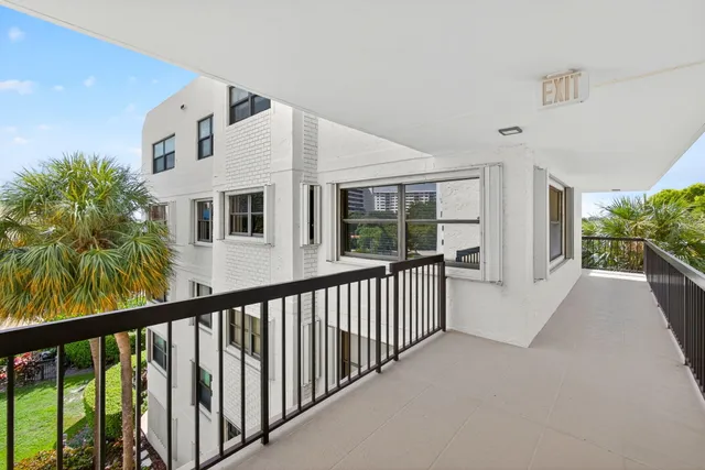a dining room with furniture and front door