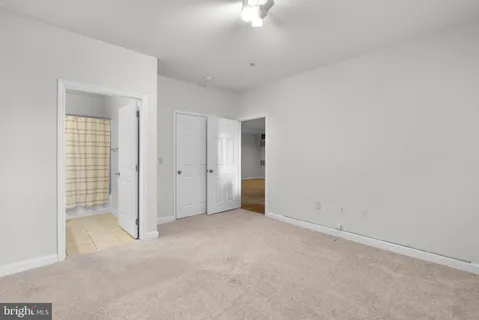 an empty room with a bathroom