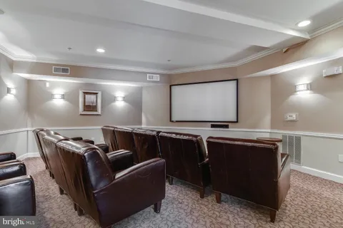 a black and white checkered floor with a large mirror