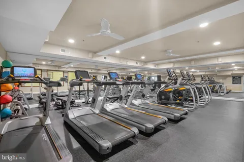 a living room with furniture a table and chairs