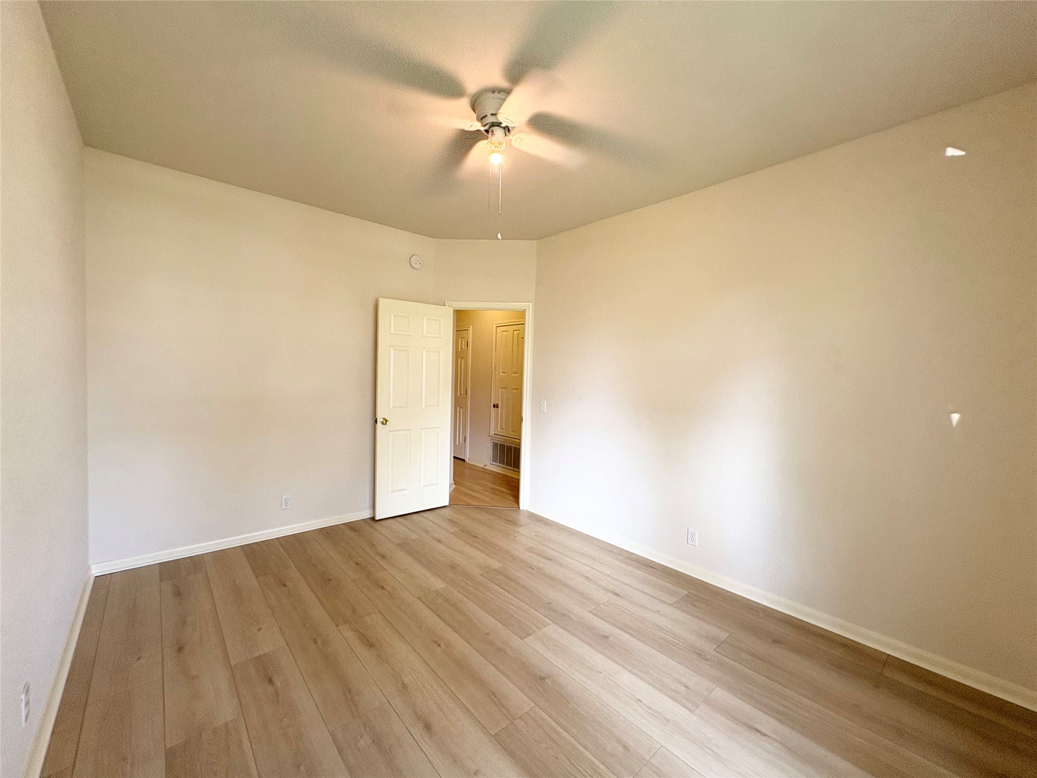 7006 Rambollet Terrace Round Rock, TX 78681 - Photo 28 of 38 A well-proportioned bedroom showcases smooth walls and durable, light-toned plank flooring.