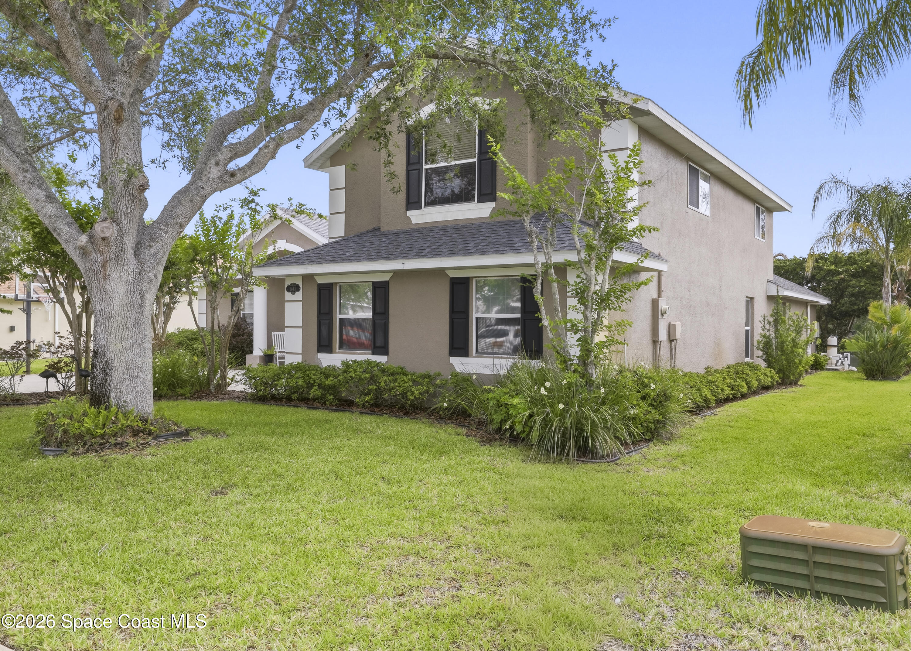 1643 Long Pine Road Melbourne, FL 32940 - Photo 5 of 63 a view of a brick house with a yard