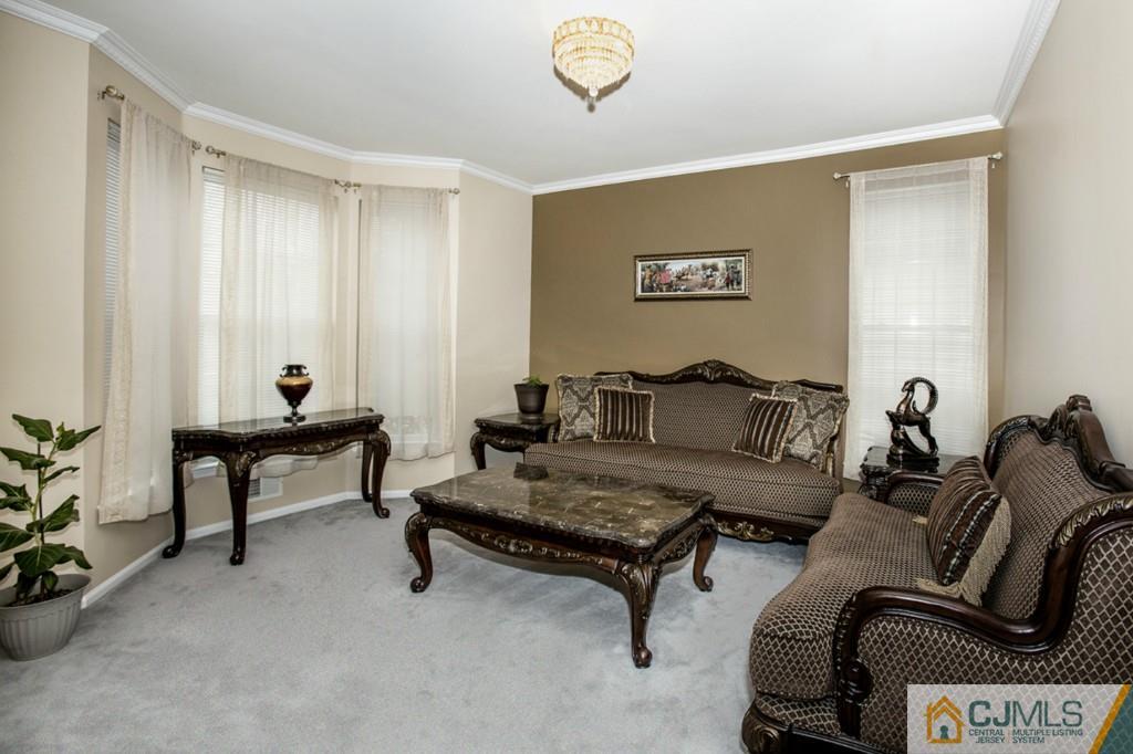 27 Timber Ridge Road North Brunswick, NJ 08902 - Photo 2 of 25 a living room with furniture