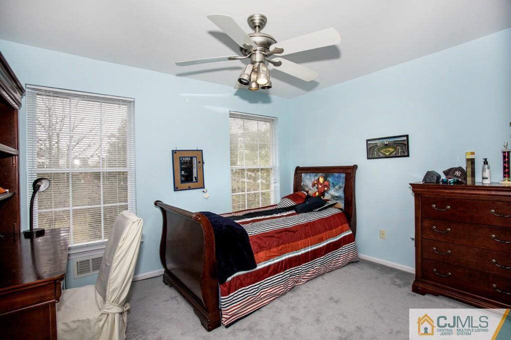 27 Timber Ridge Road North Brunswick, NJ 08902 - Photo 16 of 25 a bedroom with a bed and window