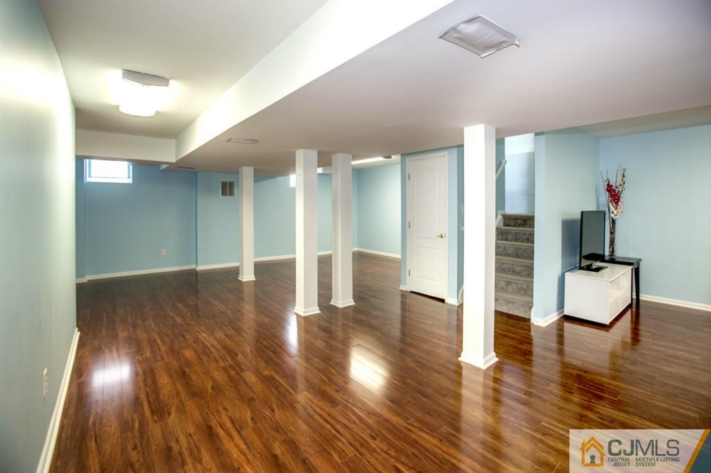 27 Timber Ridge Road North Brunswick, NJ 08902 - Photo 21 of 25 a view of an entryway with wooden floors and couches