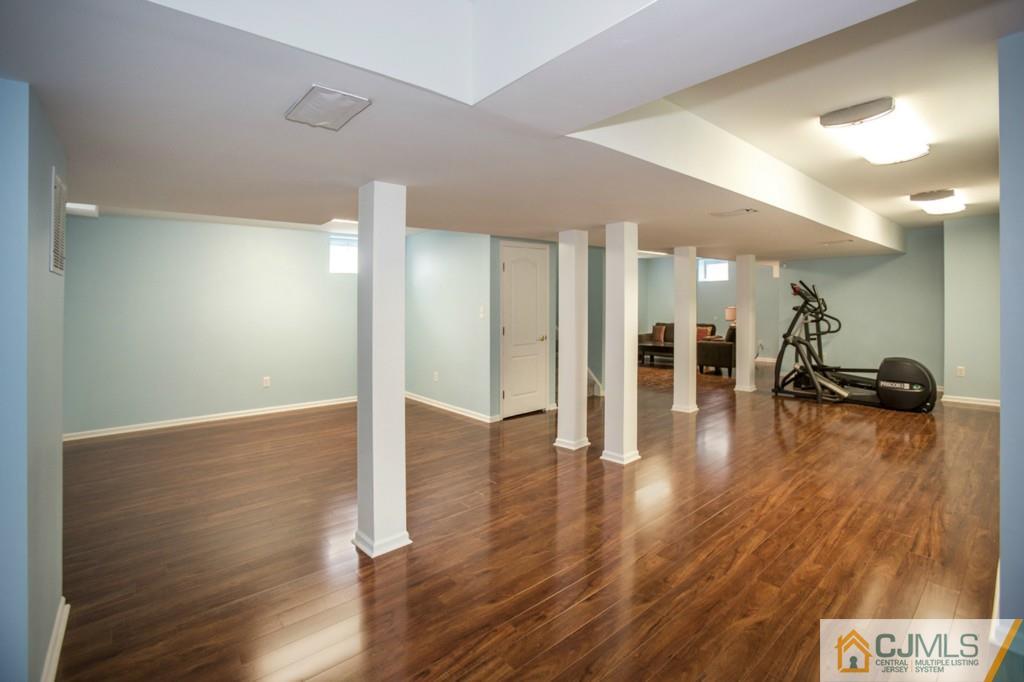 27 Timber Ridge Road North Brunswick, NJ 08902 - Photo 23 of 25 a view of a hallway with wooden floor