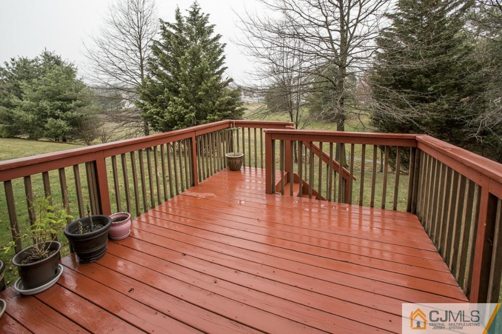 27 Timber Ridge Road North Brunswick, NJ 08902 - Photo 24 of 25 a view of balcony with wooden floor and fence