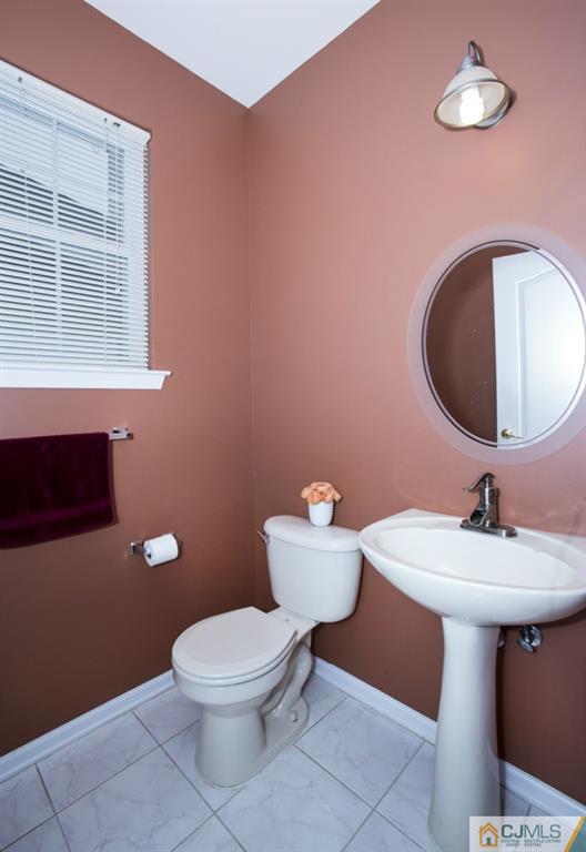 27 Timber Ridge Road North Brunswick, NJ 08902 - Photo 8 of 25 a bathroom with a toilet sink and mirror