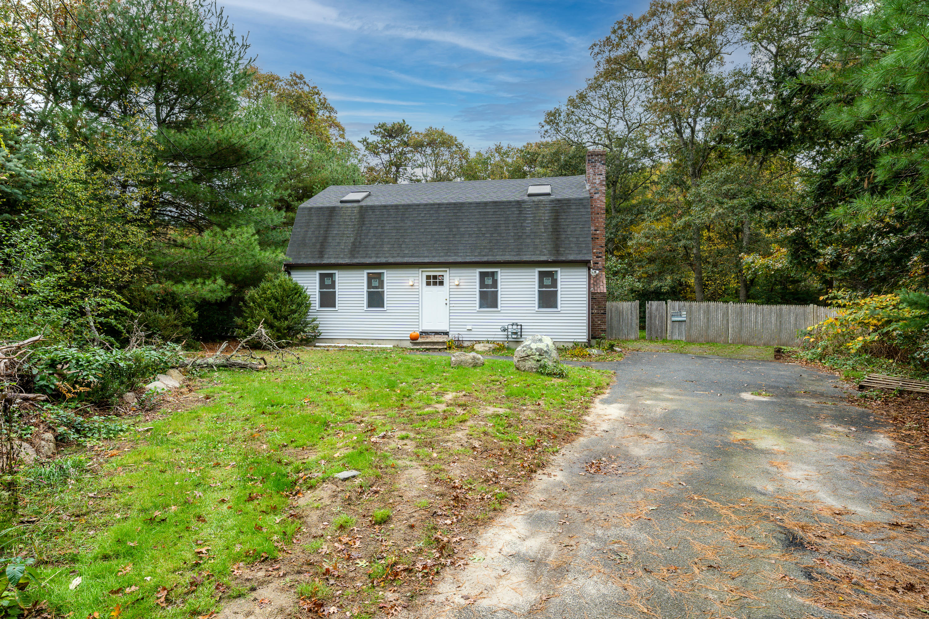 432 Skunknet Road Centerville, MA 02632 - Photo 3 of 18 a front view of house with yard and green space
