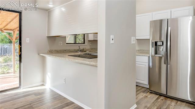 2040 South Chelton Road Colorado Springs, CO 80916 - Photo 7 of 27 Beautiful updated kitchen with stainless steel appliances.
