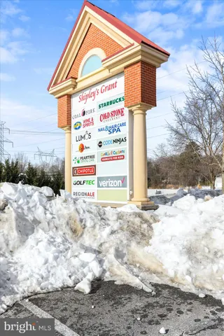 a street sign on a street next to a building