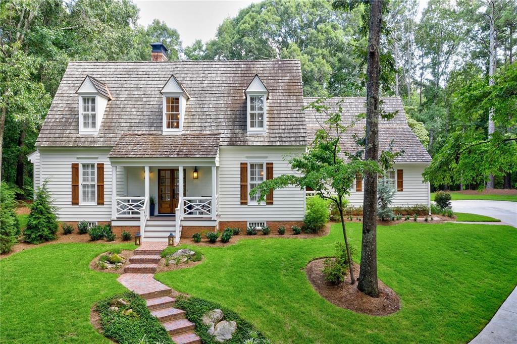 15000 East Bluff Road Milton, GA 30004 - Photo 1 of 1 a front view of a house with a yard