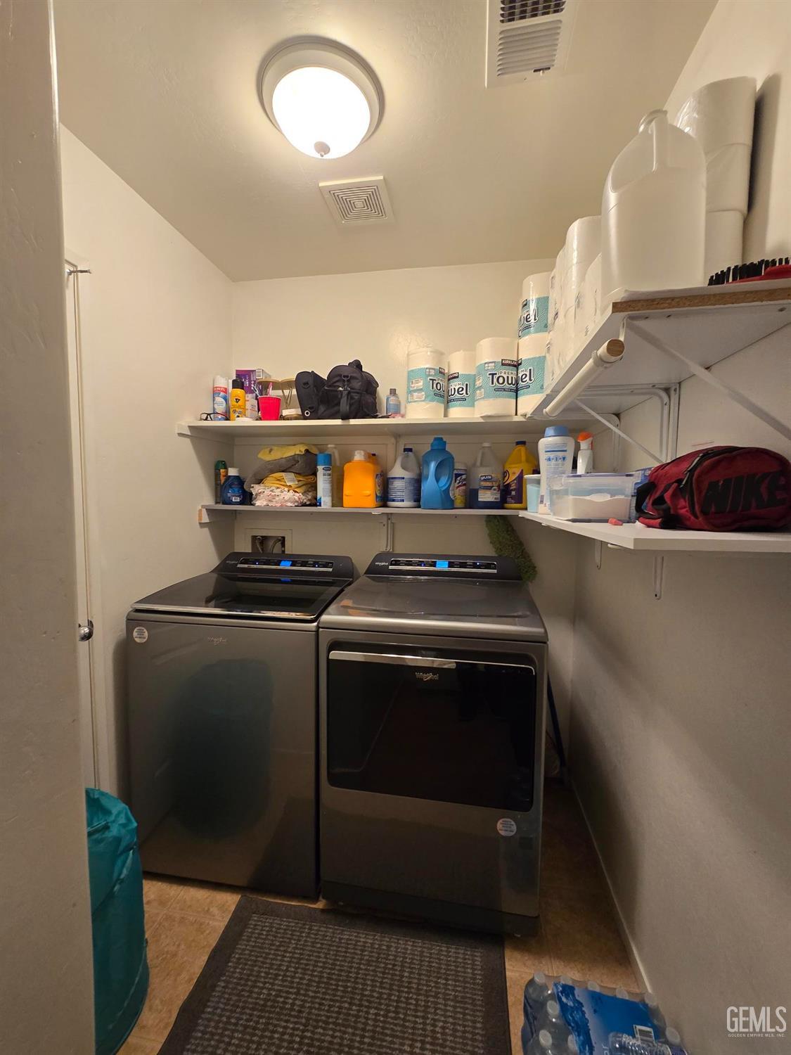 Undisclosed Address Bakersfield, CA 93307 - Photo 11 of 19 a utility room with washer and dryer