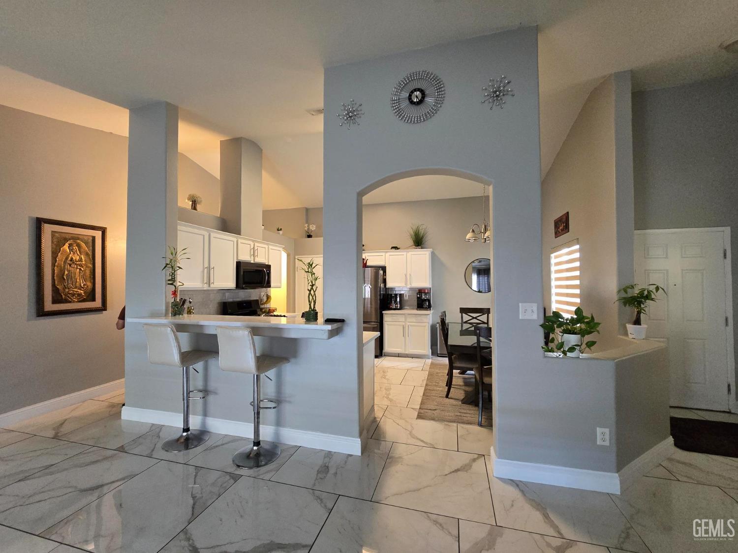 Undisclosed Address Bakersfield, CA 93307 - Photo 6 of 19 a view of a dining hall with a dining table and chairs