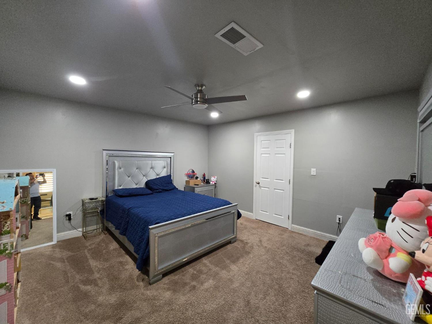 Undisclosed Address Bakersfield, CA 93307 - Photo 9 of 19 a bedroom with a bed and a window