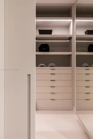 a bedroom with a bed and a table