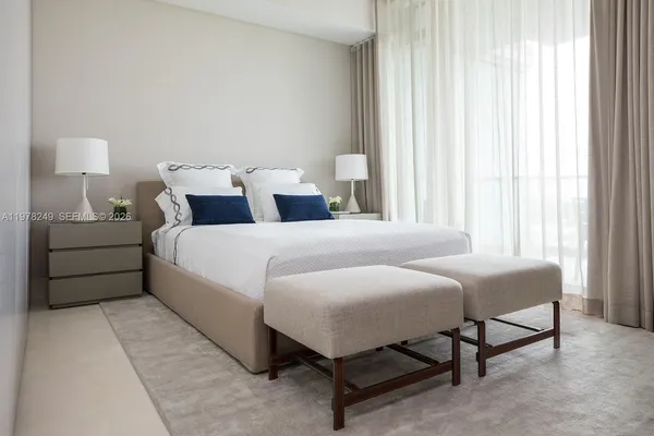 a view of a patio with couches chairs and city view