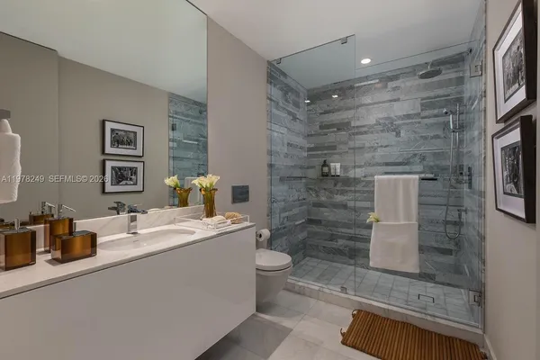 a view of a balcony with table and chairs