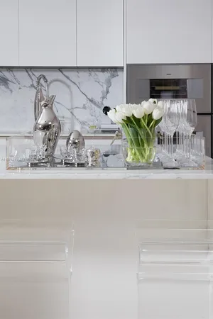 a bedroom with a bed and a flat tv screen on the dresser
