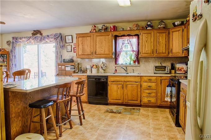 951 Copella Road Bath, PA 18014 - Photo 2 of 25 a kitchen with a sink a stove and cabinets