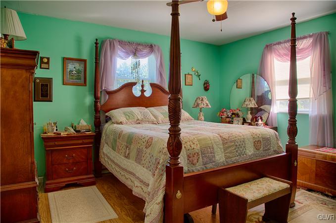 951 Copella Road Bath, PA 18014 - Photo 8 of 25 a bedroom with a bed and a chandelier