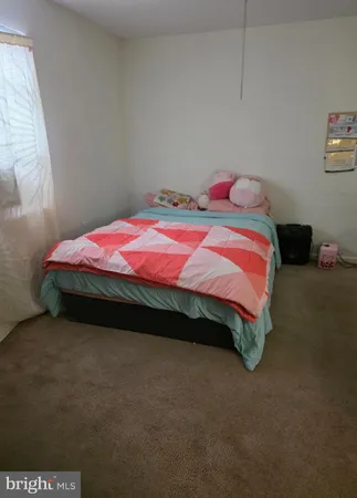 a bedroom with a bed and a table