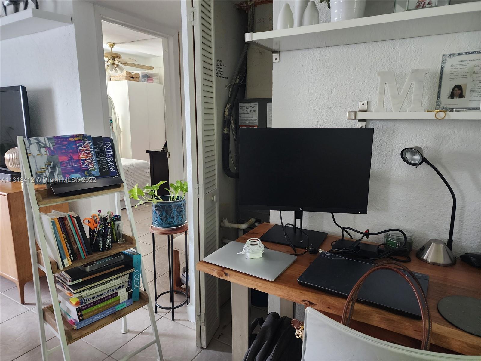 8600 Southwest 67th Avenue, Unit 906 Pinecrest, FL 33156 - Photo 14 of 27 a view of a workspace with furniture