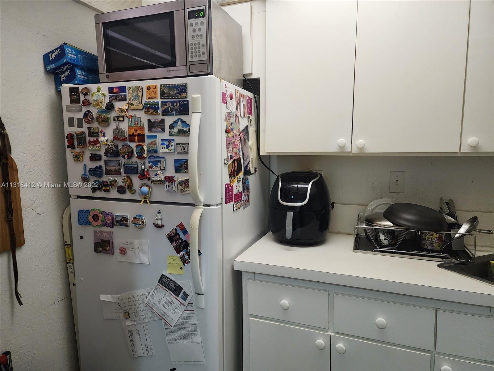 8600 Southwest 67th Avenue, Unit 906 Pinecrest, FL 33156 - Photo 16 of 27 a kitchen with a cabinets and a window