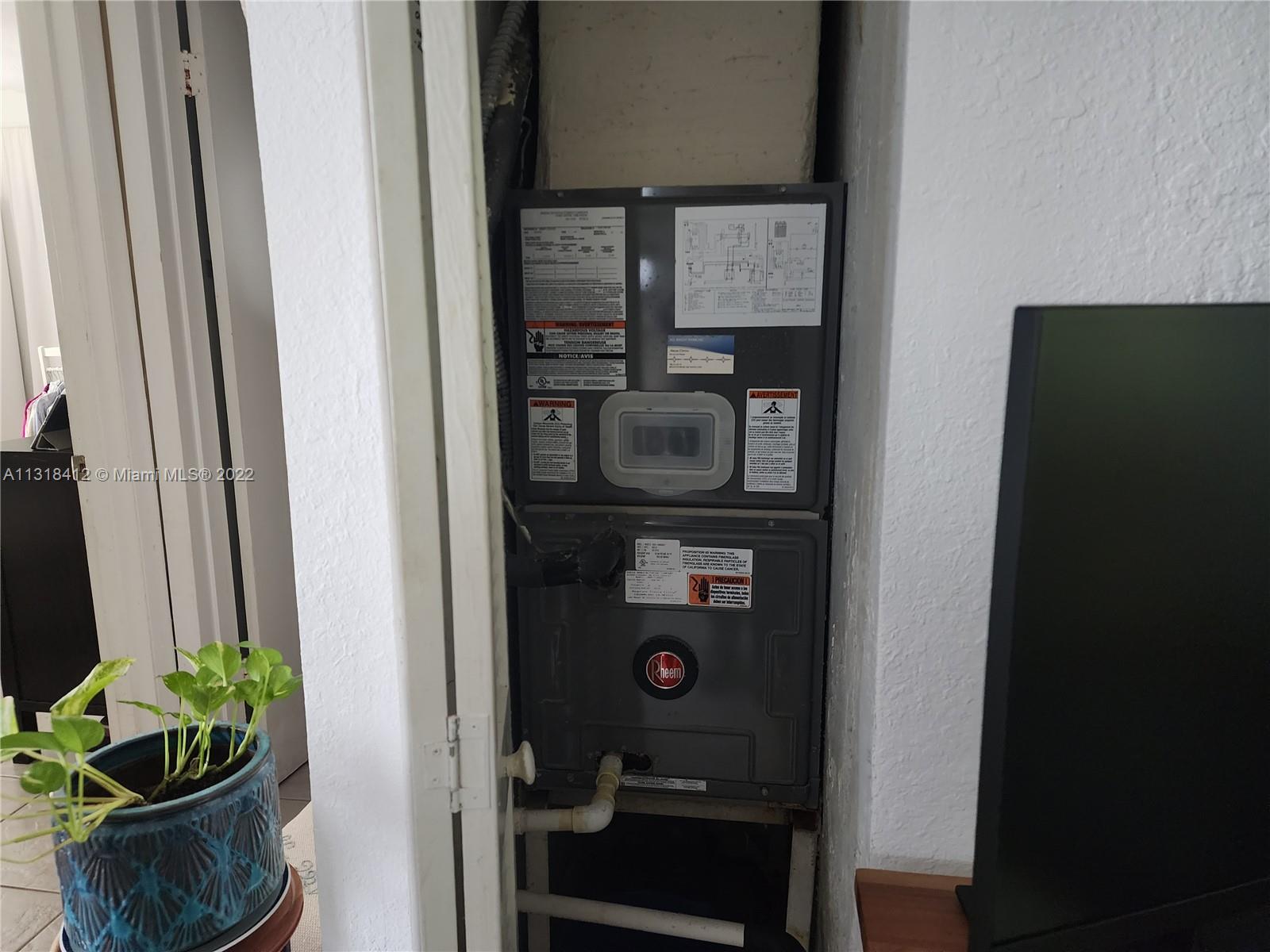 8600 Southwest 67th Avenue, Unit 906 Pinecrest, FL 33156 - Photo 18 of 27 a close view of shoes and cabinets